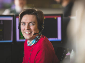 alt="Lemon Contact Centre call centre operator smiling at camera"