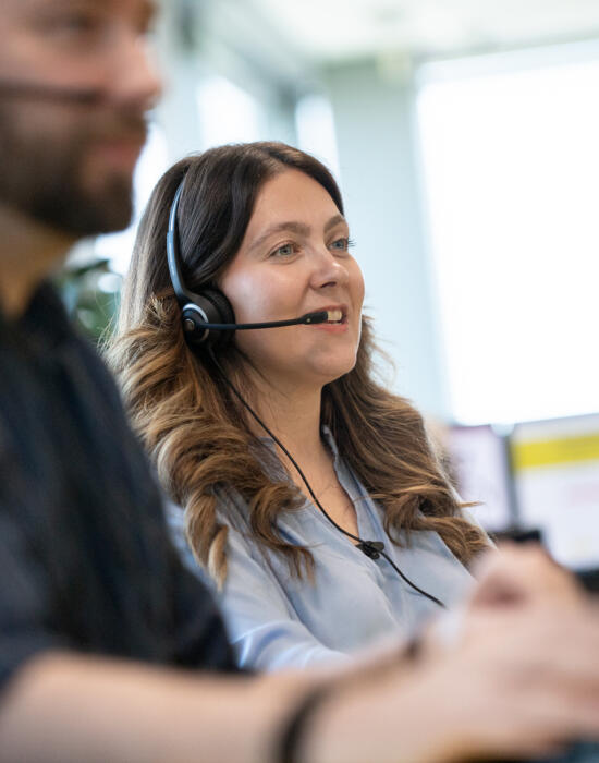 alt="male and female call centre operators at Lemon Contact Centre"