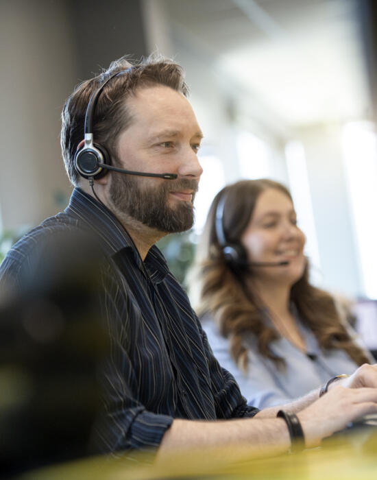 alt="two Lemon Contact Centre operators taking calls"