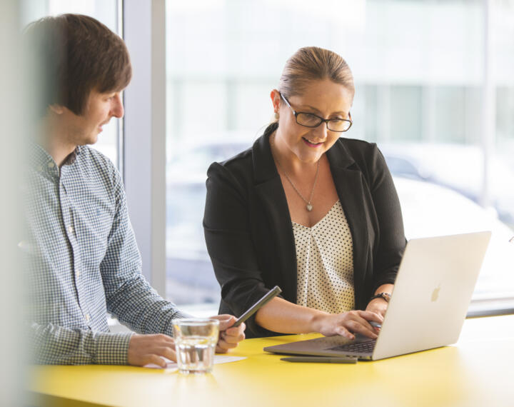 alt="Lemon Contact Centre man and woman having a meeting"