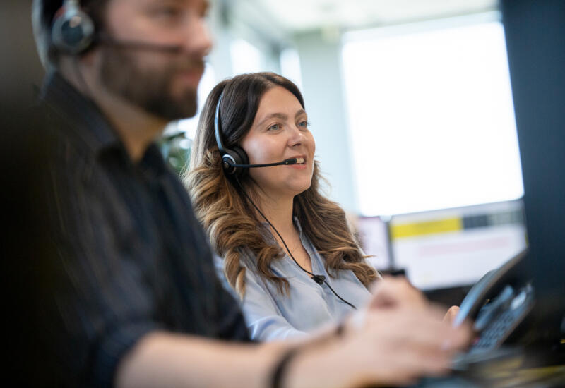 alt="male and female call centre operators at Lemon Contact Centre"